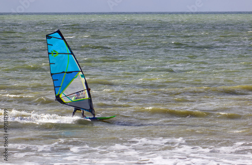 Windsurfer in the Gulf of Morbihan during a rainy afternoon at Penviens Sarzeau.