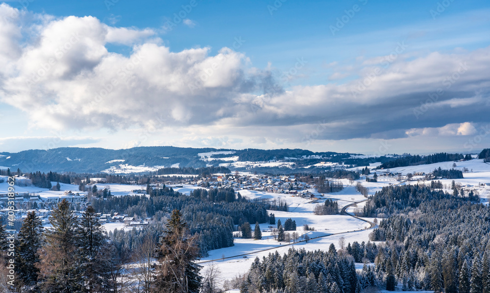 Fototapeta premium winter landscape in the lower western Allgaeu Alps with the village of Oberreute