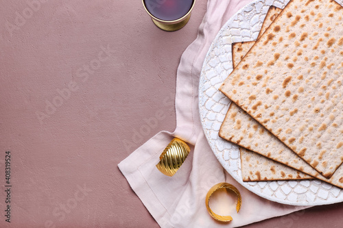 Canvas Print Plate with Jewish flatbread matza for Passover and cup of wine on color backgrou