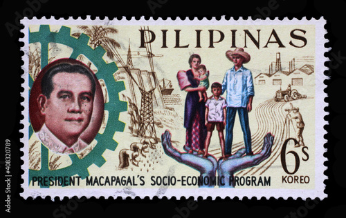 Stamp printed in Philippines shows President Macapagal and Filipino family, Series 5-year Socioeconomic Program, circa 1963.