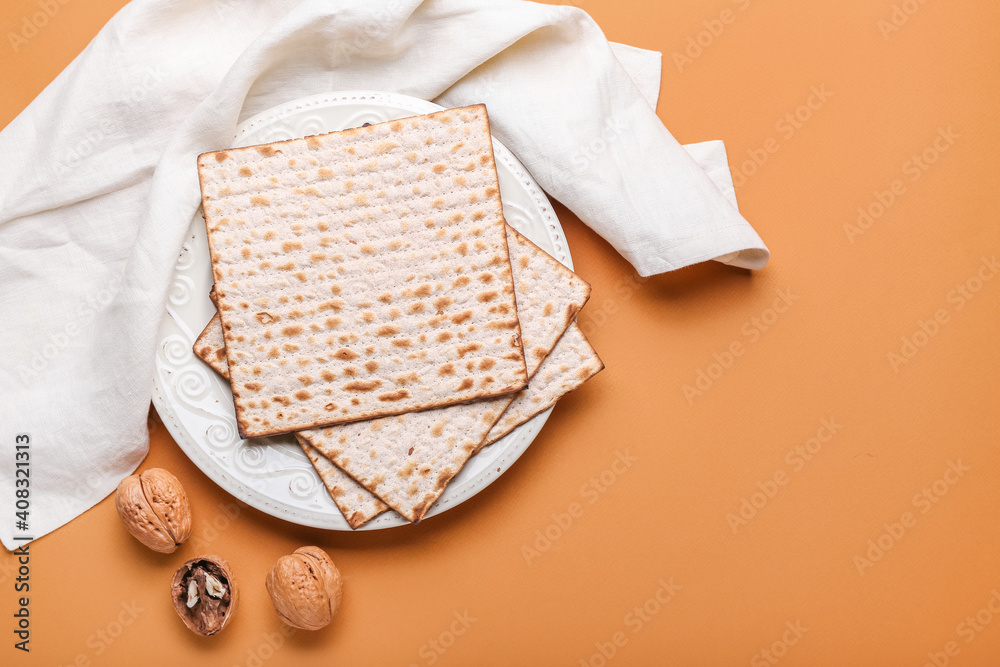 Plate with Jewish flatbread matza for Passover on color background