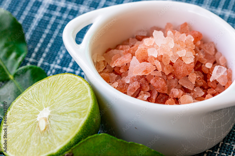bowl of pink Himalayan salt with fresh lime bowl of pink Himalayan salt with fresh lime