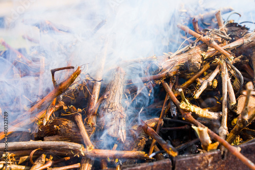 Firewood in the grill, metal grill and fire for meal and meat, barbeque fire