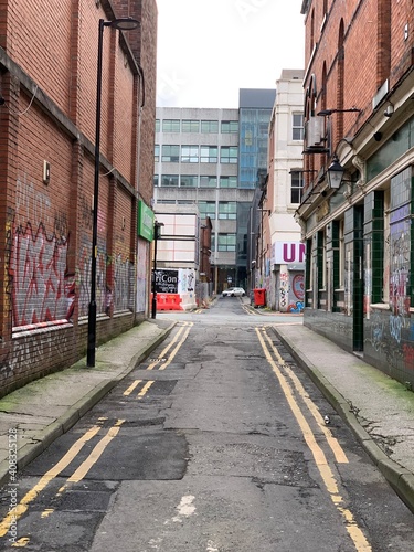 City street in Manchester City centre with landmark buildings and modern architecture. 