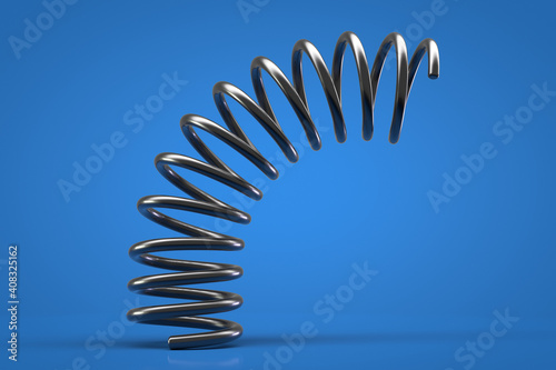 Flexible ring spring close up. Blue background.