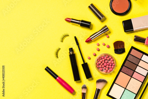 Makeup professional cosmetics on color background. Top view with copy space.