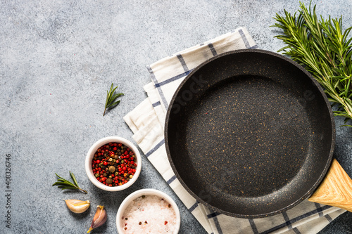 Food background. Kitchen table with herbs, spices and olive oil. Top view with copy space.