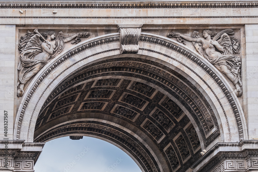 Architectural fragment of Arc de Triomphe. Arc de Triomphe de l'Etoile on Charles de Gaulle Place is one of the most famous monuments in Paris. France.