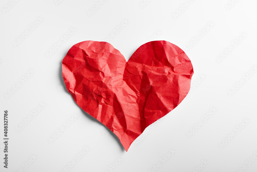 © Thawatchai - Crumpled red heart paper isolated on white background. Broken heart concept.