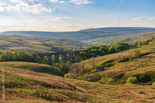 The Dent Head Viaduct with the Dent Dale landscape in the background, near Cowgill, Cumbria, England, UK