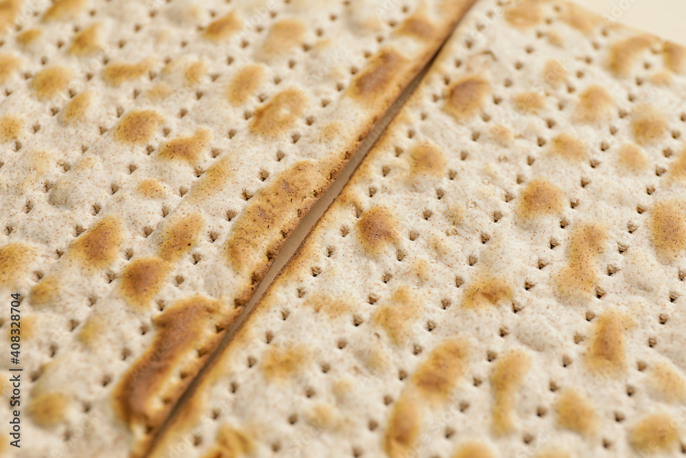 Jewish flatbread matza for Passover as background, closeup
