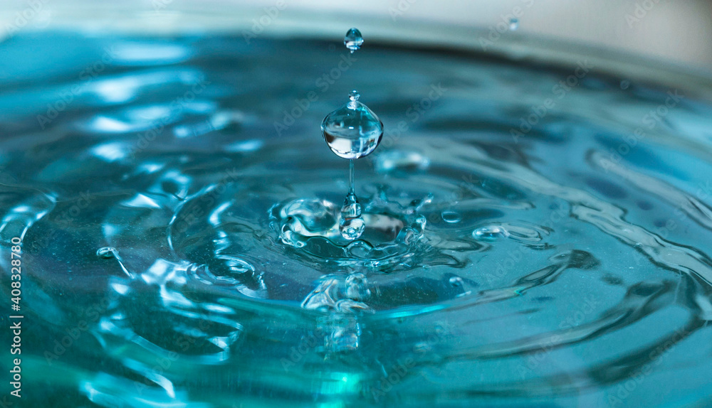 drop of water against blue background