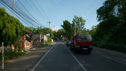 sunny day bali island jimbaran district scooter road trip passenger pov panorama 4k indonesia photo