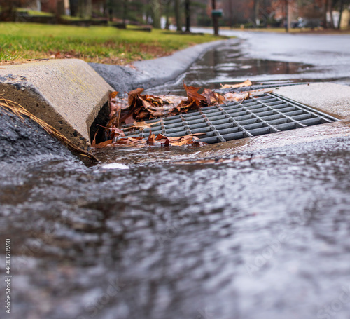 water running into a storm drain
