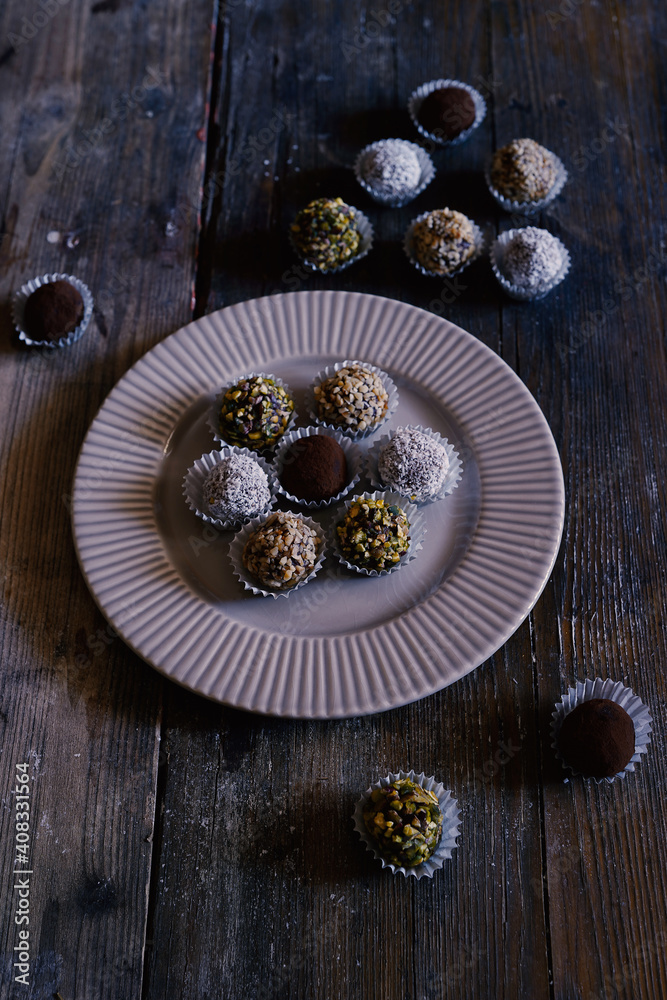 Chocolate and vanilla cake pops with sugar glaze on top Chocolate and vanilla cake pops with sugar glaze on top