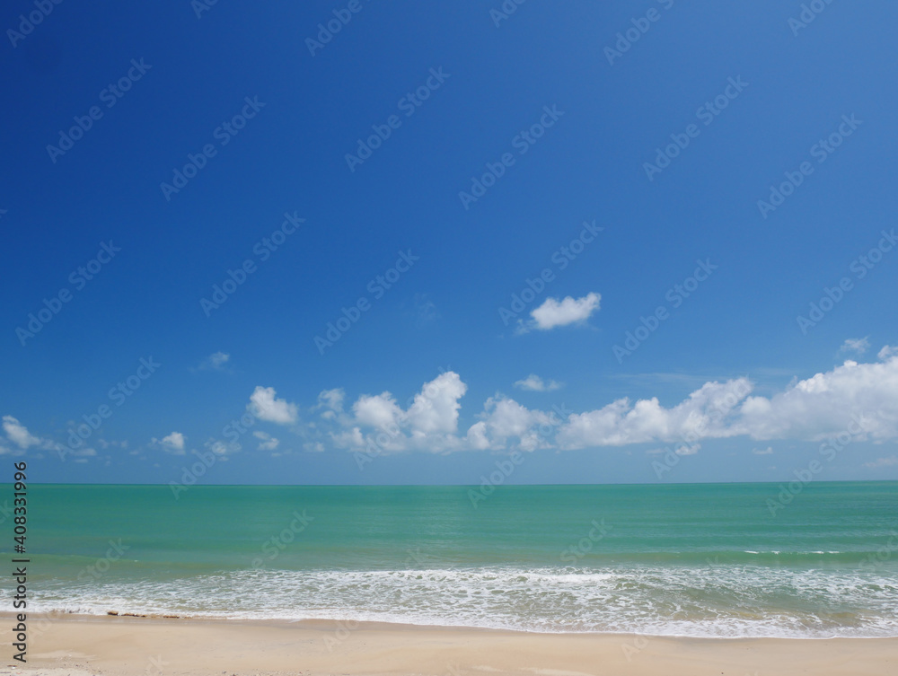 Beautiful tropical sea and sand beach with blue sky for background
