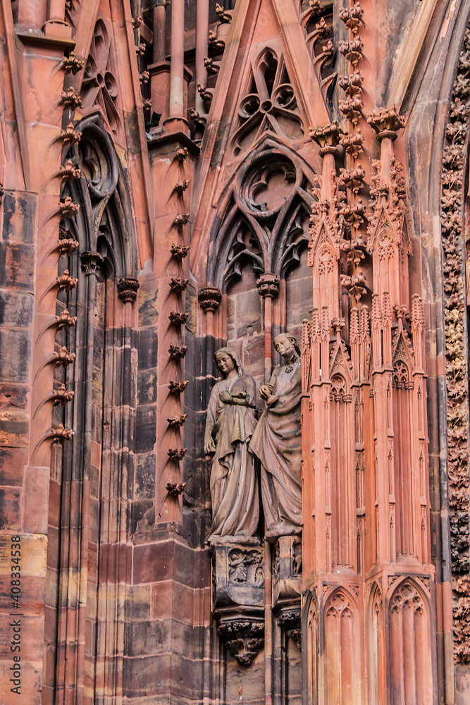 Naklejka premium Architectural fragments of Strasbourg Cathedral Main Portal (Cathedral of Our Lady of Strasbourg or Cathedrale Notre-Dame de Strasbourg, 1439) - Roman Catholic cathedral in Strasbourg, Alsace, France.