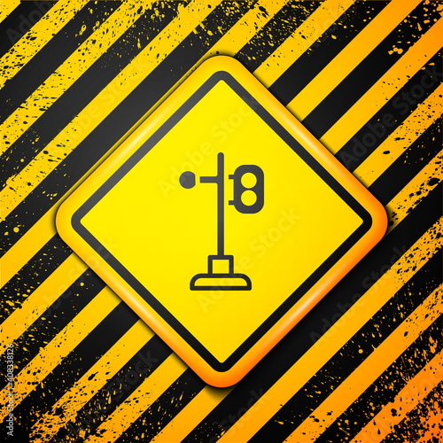 Black Train traffic light icon isolated on yellow background. Traffic lights for the railway to regulate the movement of trains. Warning sign. Vector.