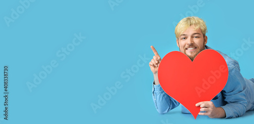 Handsome man with big red h...