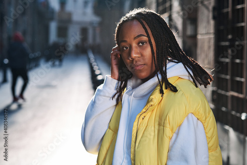 African american woman standing outdoors.