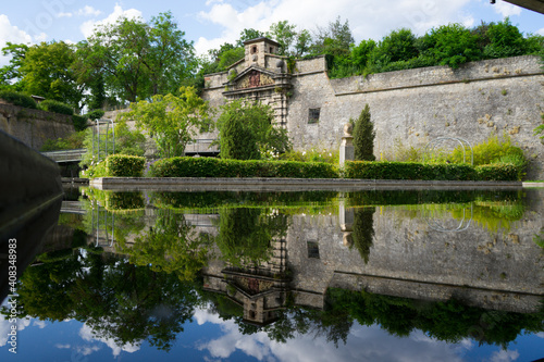 castle in the park with water reflection