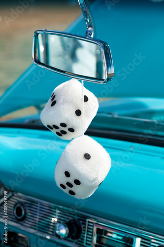 Fuzzy Dice On Mirror of Vintage Automobile.