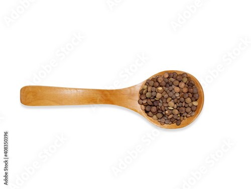 Top view wooden spoon with lentil isolated on a white background. Kitchen utensil and cooking ingredients template.