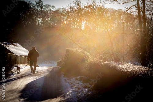man walking his dog in winter