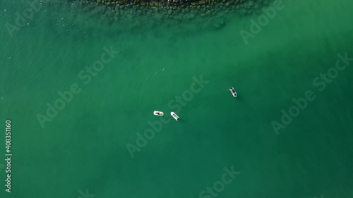 Top view of jet-skis floating on the ocean, coast blue-green crystal clear water of Dubai's Mamzar beach, Arabian Sea, top tourist attraction, 4k Footage photo