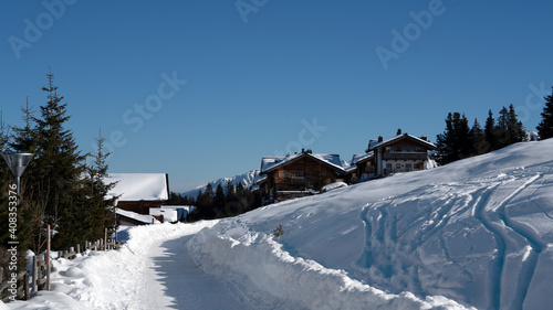 snow wandering in a village on the mountains on a beautiful sunny winter day © Chamois huntress