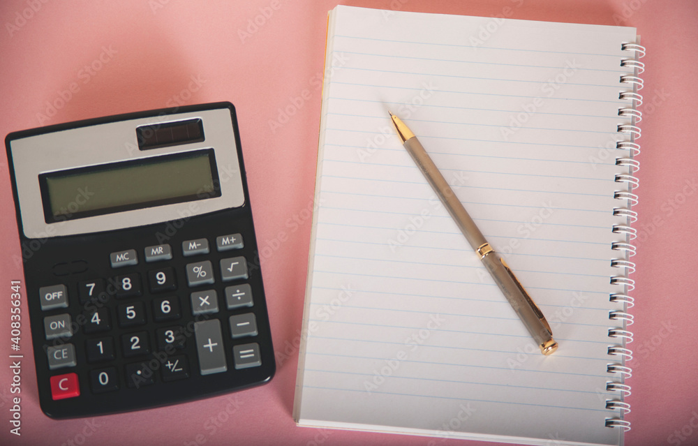 calculator on notepad and pen calculator on notepad and pen