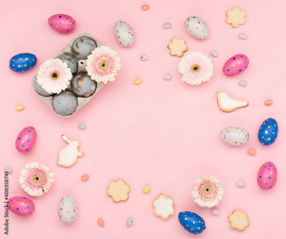 Homemade Easter sugar cookies, chocolate eggs, flowers on pastel pink background. Festive Easter breakfast concept. Homemade Easter sugar cookies, chocolate eggs, flowers on pastel pink background. Festive Easter breakfast concept.