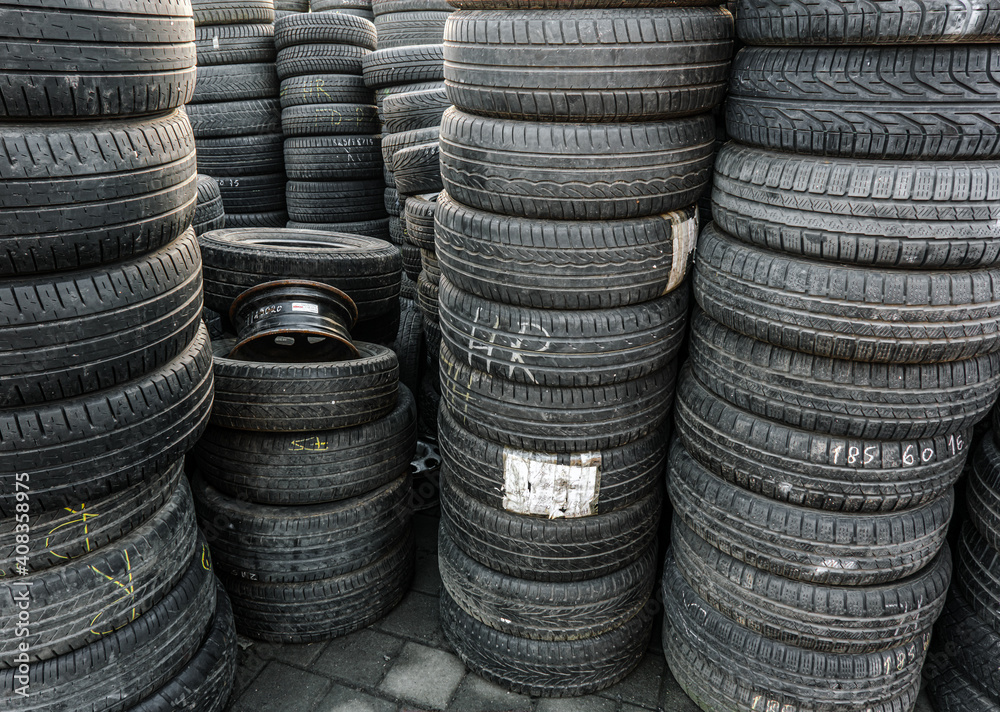 Used tire stacks in Workshop vulcanization yard in the city Used tire stacks in Workshop vulcanization yard in the city