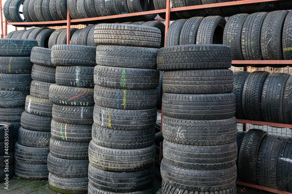 Used tire stacks in Workshop vulcanization yard in the city