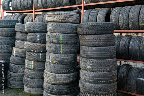 Used tire stacks in Workshop vulcanization yard in the city