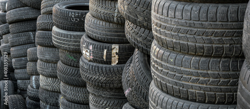 фотографія Used tire stacks in Workshop vulcanization yard in the city