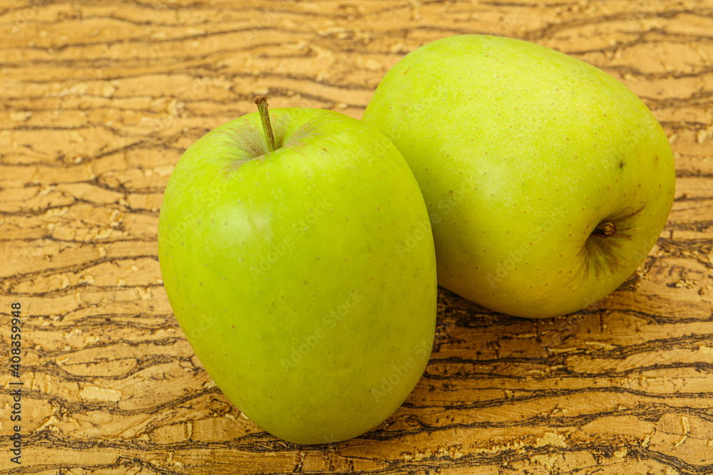Two ripe green sweet apples