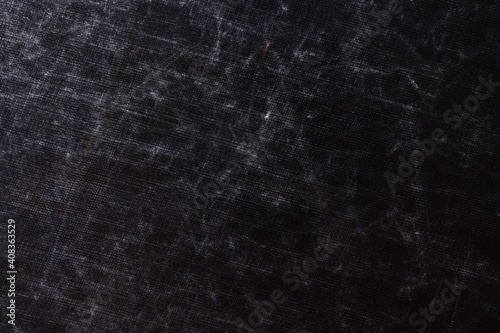 The texture of scratches on fabric on a black background