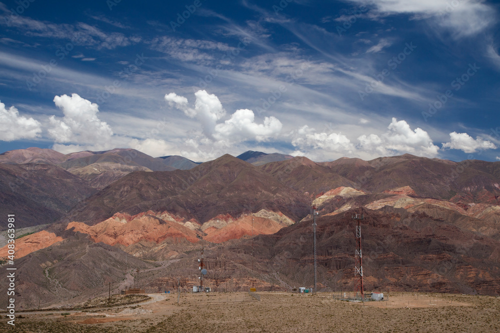 Colorful Humahuaca ravine under a magical blue sky with clouds. The ...
