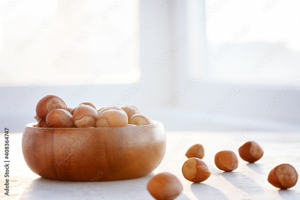 Close-up of hazelnuts on a light background. Close-up of hazelnuts on a light background.