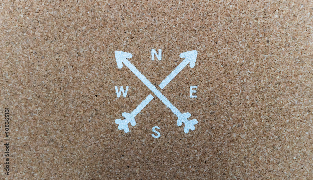 On cork, and painted white, two crossed arrows forming an X, and in their holes the initials of the cardinal points, north, south, east and west. On cork, and painted white, two crossed arrows forming an X, and in their holes the initials of the cardinal points, north, south, east and west.