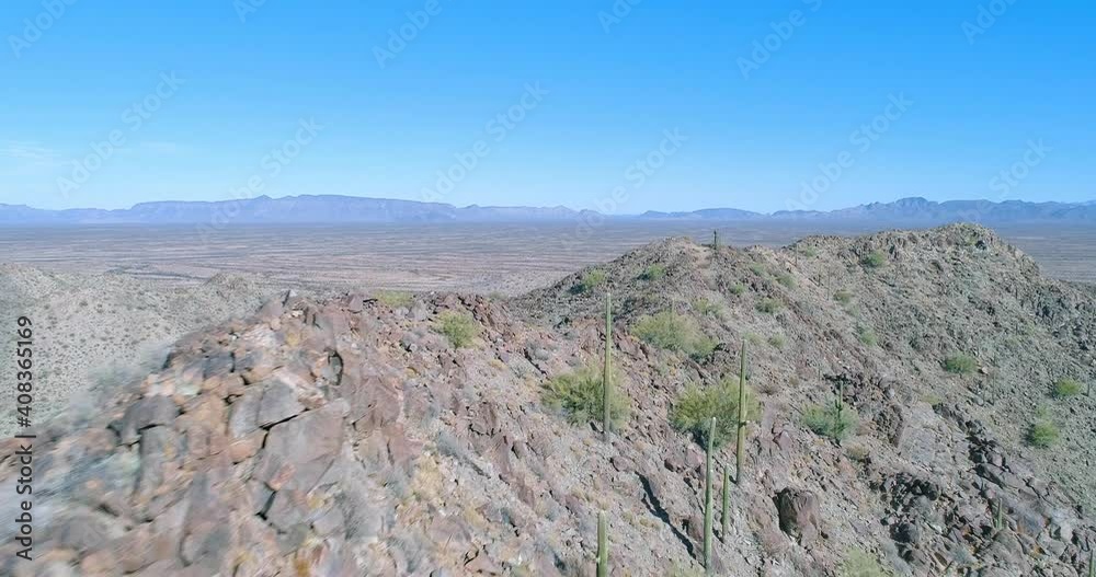 Flying over desert peak with saguaro cactus drone aerial shot Flying over desert peak with saguaro cactus drone aerial shot
