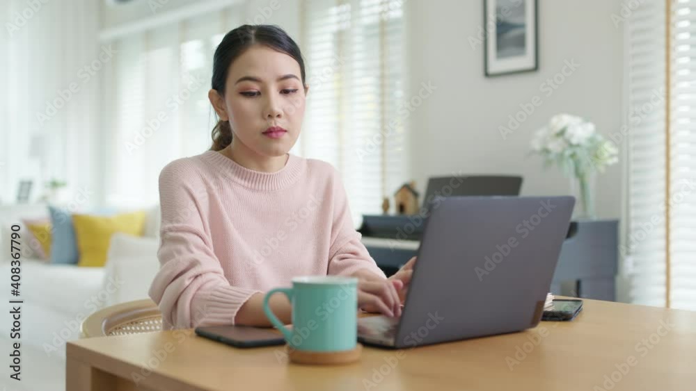 Young attractive beautiful asia happy female take coffee break rest relax from work computer notebook at home move out from table to refill drink. Lifestyle at home quarantine social distance concept. Young attractive beautiful asia happy female take coffee break rest relax from work computer notebook at home move out from table to refill drink. Lifestyle at home quarantine social distance concept.