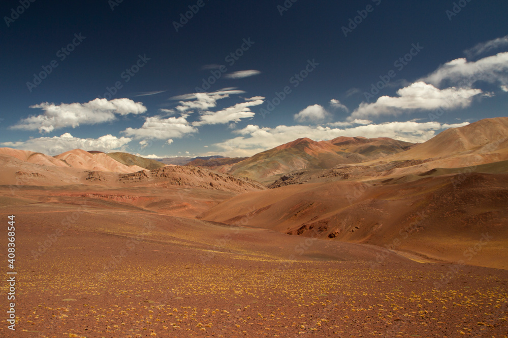 Desert landscape high in the Andes mountain range. View of the dunes, brown land and colorful mountains in Laguna Brava, La Rioja, Argentina.