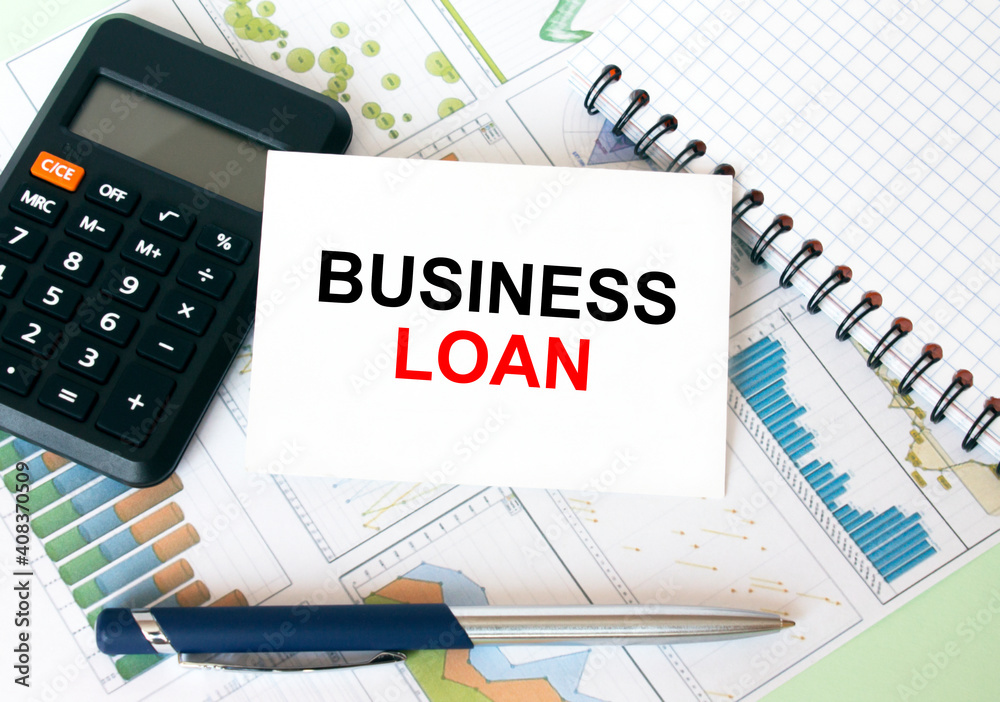 Business card with text Business Loan laying on financial graphs Business card with text Business Loan laying on financial graphs