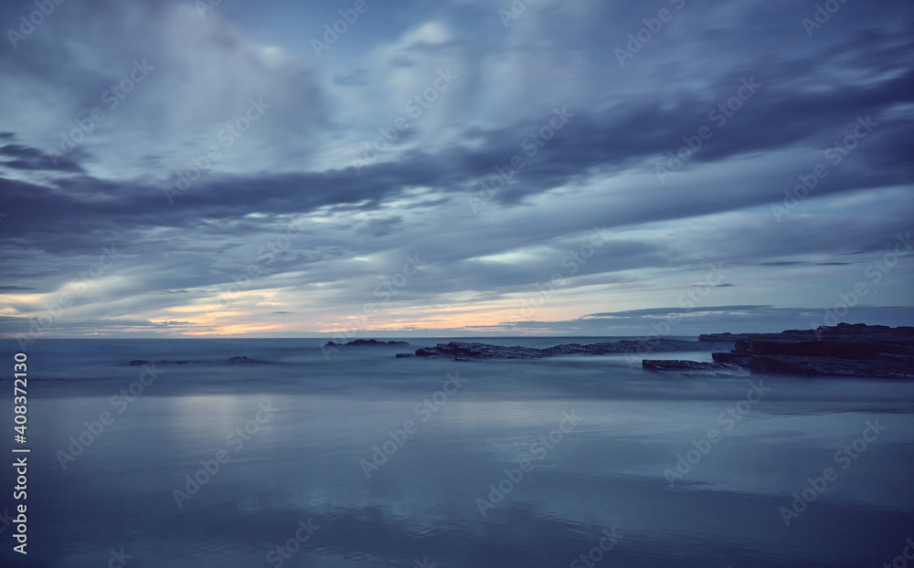 Obraz premium Sunset at the beach. Catedrales beach on the coast of Galicia