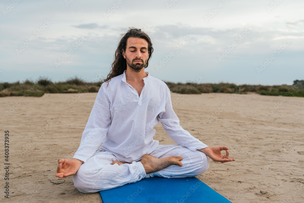 Concentrated Man Practicing Yoga Outdoors