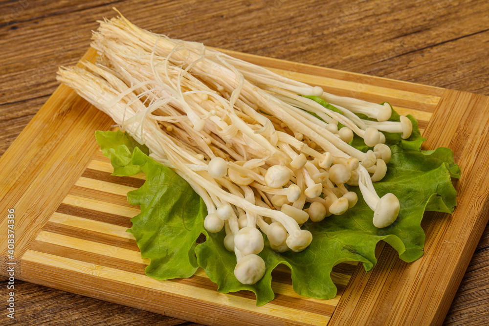 Raw Enoki mushrooms for cooking