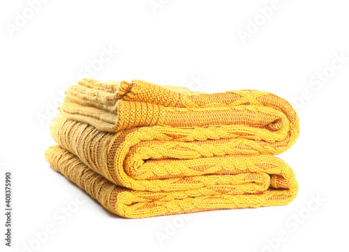 Stylish yellow knitted plaid on white background