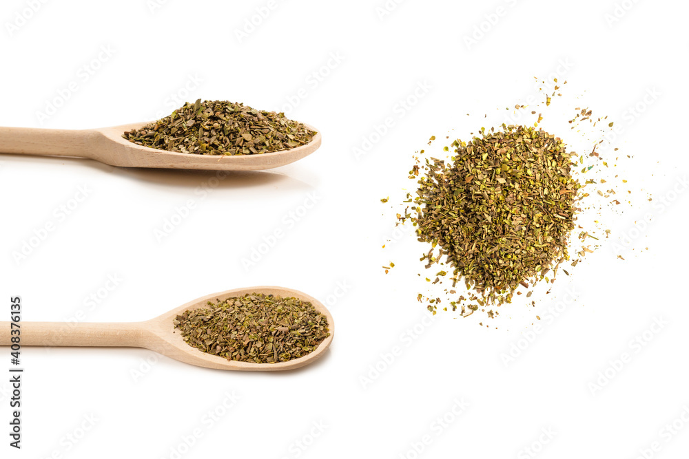 Oregano spice in wooden spoon isolated. Oregano spice in wooden spoon isolated.